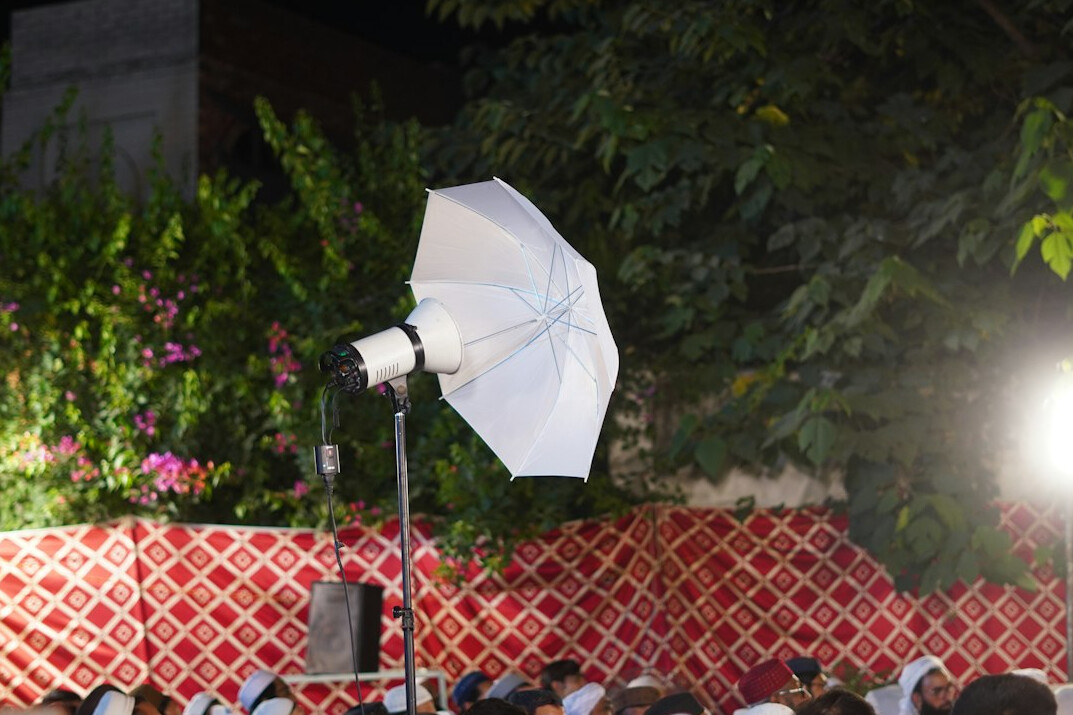 Film set with camera and lighting equipment